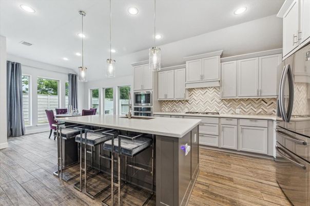 Dining room, Interior, Kitchen, Pendant Lights, Recessed Lighting, Stainless Steel Appliances, Wood Texture Flooring