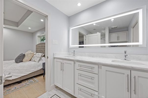 Bathroom, Bedroom, Dual Sink Vanities, Interior, Recessed Lighting, Wood Texture Flooring