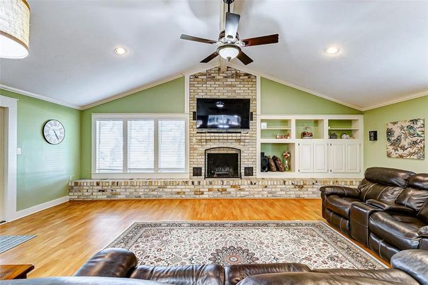 Fireplace, Interior, Living room, Recessed Lighting, Stone Walls, Wood Texture Flooring