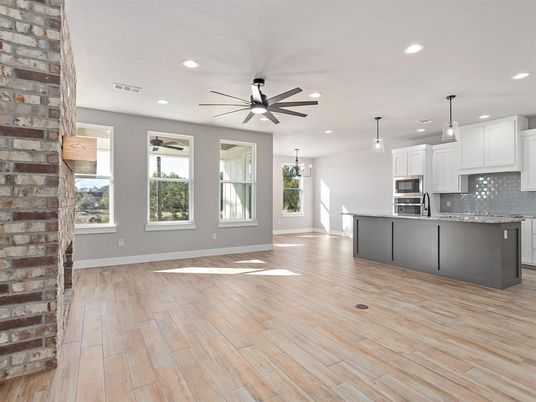 Empty room, Interior, Kitchen, Pendant Lights, Recessed Lighting, Stainless Steel Appliances, Stone Walls, Wood Texture Flooring