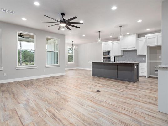 Chandelier, Empty room, Interior, Kitchen, Pendant Lights, Recessed Lighting, Stainless Steel Appliances, Wood Texture Flooring