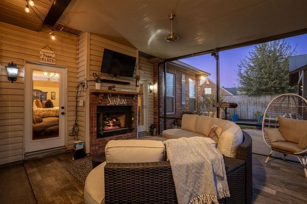 Exterior, Fireplace, Wood Texture Flooring