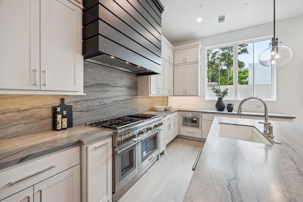 Interior, Kitchen, Marble Walls, Pendant Lights, Recessed Lighting, Stainless Steel Appliances, Wood Texture Flooring