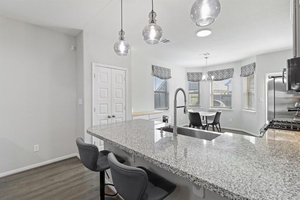 Dining room, Interior, Kitchen, Pendant Lights, Stainless Steel Appliances, Wood Texture Flooring