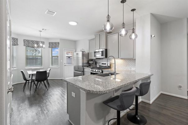 Dining room, Interior, Kitchen, Pendant Lights, Recessed Lighting, Stainless Steel Appliances, Wood Texture Flooring