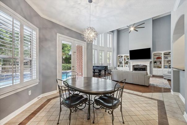 Chandelier, Dining room, Fireplace, Interior, Living room, Pendant Lights, Piano, Wood Texture Flooring