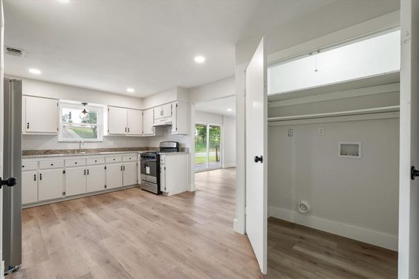 Interior, Kitchen, Recessed Lighting, Stainless Steel Appliances, Wood Texture Flooring