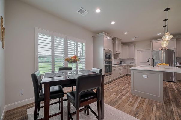 Dining room, Interior, Kitchen, Pendant Lights, Recessed Lighting, Stainless Steel Appliances, Wood Texture Flooring