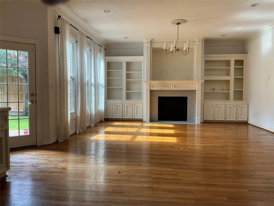 Chandelier, Empty room, Fireplace, Interior, Recessed Lighting, Wood Texture Flooring