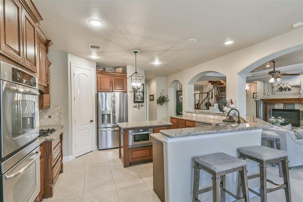 Fireplace, Interior, Kitchen, Pendant Lights, Recessed Lighting, Stainless Steel Appliances