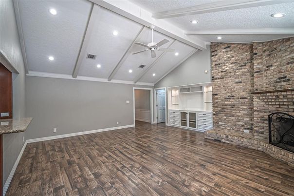 Empty room, Fireplace, Interior, Recessed Lighting, Stone Walls, Wood Texture Flooring