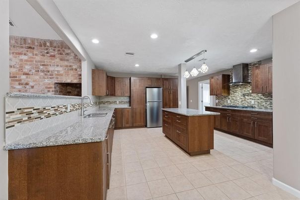 Interior, Kitchen, Pendant Lights, Recessed Lighting, Stainless Steel Appliances, Stone Walls