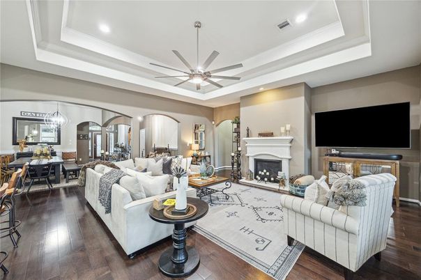 Dining room, Fireplace, Interior, Living room, Recessed Lighting, Wood Texture Flooring