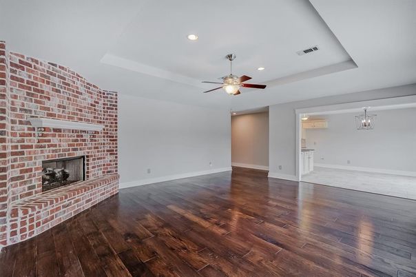 Empty room, Fireplace, Interior, Recessed Lighting, Stone Walls, Wood Texture Flooring