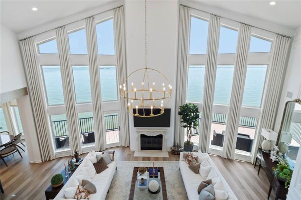 Chandelier, Fireplace, Interior, Living room, Pendant Lights, Recessed Lighting, Water, Wood Texture Flooring