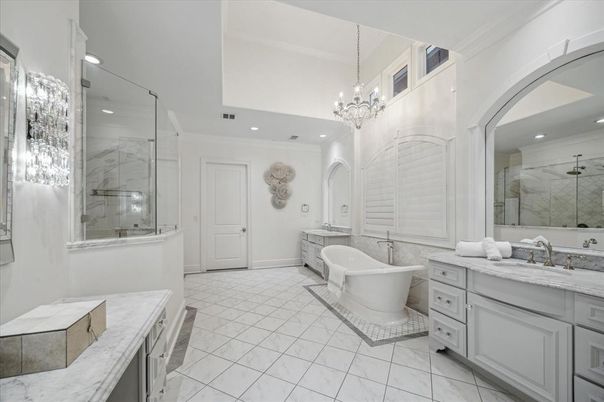 Bathroom, Chandelier, Dual Sink Vanities, Free Standing Baths, Glass Shower, Interior, Marble, Marble Walls, Recessed Lighting