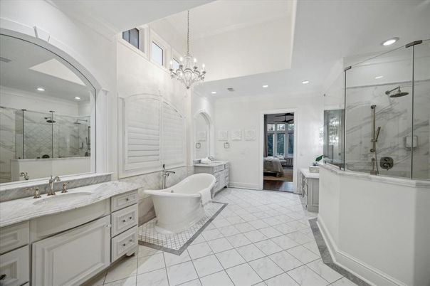 Bathroom, Chandelier, Dual Sink Vanities, Free Standing Baths, Glass Shower, Interior, Marble, Marble Walls, Recessed Lighting