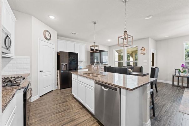 Dining room, Interior, Kitchen, Pendant Lights, Recessed Lighting, Stainless Steel Appliances, Wood Texture Flooring