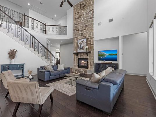 Fireplace, Interior, Living room, Recessed Lighting, Stone Walls, Wood Texture Flooring