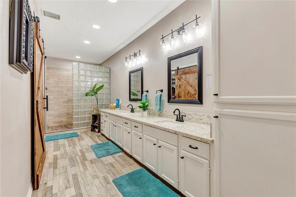 Bathroom, Dual Sink Vanities, Glass Shower, Interior, Recessed Lighting, Wood Texture Flooring