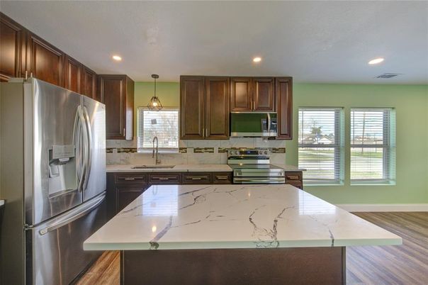 Interior, Kitchen, Pendant Lights, Recessed Lighting, Stainless Steel Appliances, Wood Texture Flooring