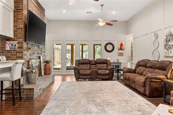 Fireplace, Interior, Living room, Recessed Lighting, Stone Walls, Wood Texture Flooring
