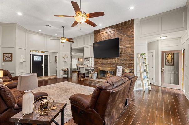 Fireplace, Interior, Living room, Recessed Lighting, Stone Walls, Wood Texture Flooring
