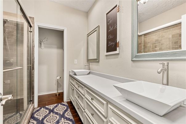 Bathroom, Dual Sink Vanities, Glass Shower, Interior, Wood Texture Flooring