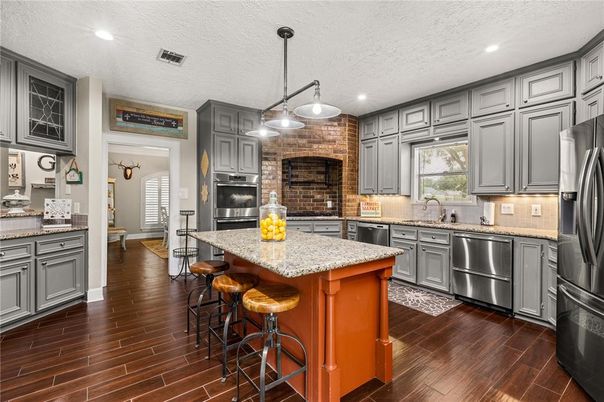 Interior, Kitchen, Pendant Lights, Recessed Lighting, Stainless Steel Appliances, Stone Walls, Wood Texture Flooring