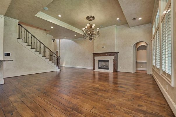 Chandelier, Empty room, Fireplace, Interior, Recessed Lighting, Wood Texture Flooring