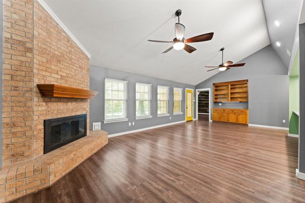 Empty room, Fireplace, Interior, Recessed Lighting, Stone Walls, Wood Texture Flooring