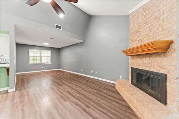 Empty room, Fireplace, Interior, Recessed Lighting, Stone Walls, Wood Texture Flooring