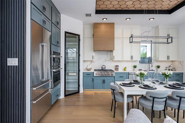 Dining room, Interior, Kitchen, Marble Walls, Pendant Lights, Recessed Lighting, Stainless Steel Appliances, Wood Texture Flooring