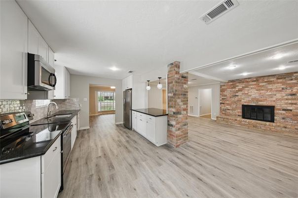 Fireplace, Interior, Kitchen, Pendant Lights, Recessed Lighting, Stone Walls, Wood Texture Flooring