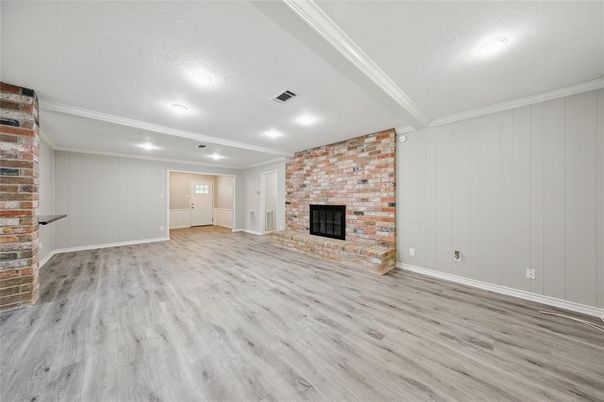 Empty room, Fireplace, Interior, Recessed Lighting, Stone Walls, Wood Texture Flooring