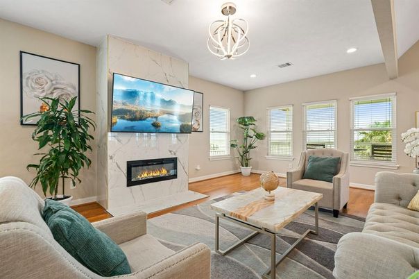 Fireplace, Interior, Living room, Marble Walls, Pendant Lights, Recessed Lighting, Wood Texture Flooring