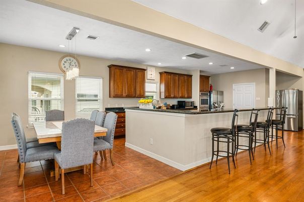 Dining room, Interior, Kitchen, Pendant Lights, Recessed Lighting, Stainless Steel Appliances, Wood Texture Flooring
