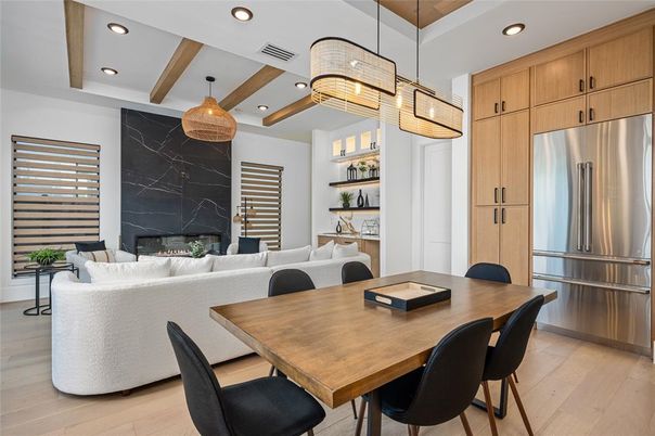 Dining room, Fireplace, Interior, Kitchen, Living room, Marble Walls, Pendant Lights, Recessed Lighting, Stainless Steel Appliances, Wood Texture Flooring