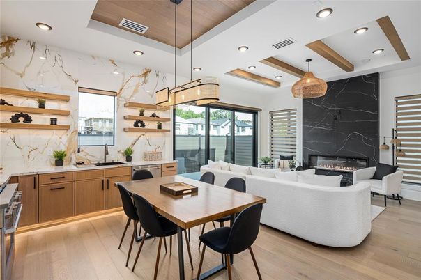 Dining room, Fireplace, Interior, Living room, Marble Walls, Pendant Lights, Recessed Lighting, Wood Texture Flooring