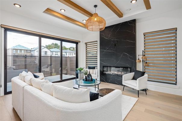 Fireplace, Interior, Living room, Marble Walls, Pendant Lights, Recessed Lighting, Wood Texture Flooring