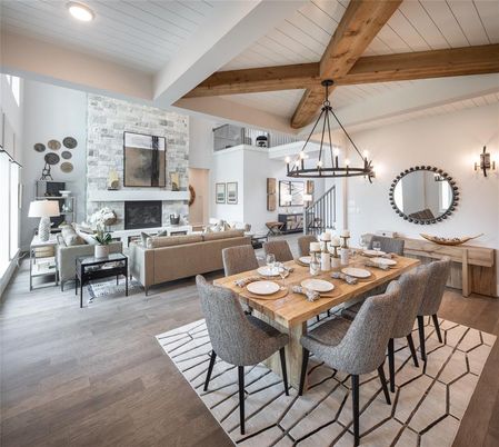 Chandelier, Dining room, Fireplace, Interior, Living room, Recessed Lighting, Stone Walls, Wooden Beams, Wood Texture Flooring