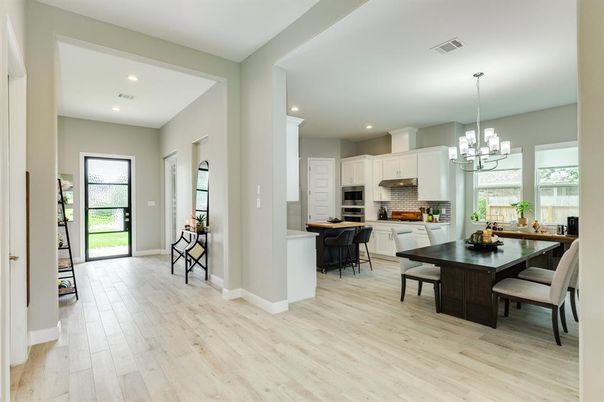 Chandelier, Dining room, Interior, Kitchen, Recessed Lighting, Stainless Steel Appliances, Wood Texture Flooring