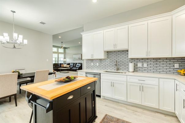 Chandelier, Dining room, Interior, Kitchen, Living room, Pendant Lights, Recessed Lighting, Wood Texture Flooring