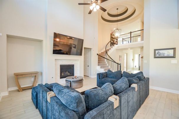 Chandelier, Fireplace, Interior, Living room, Pendant Lights, Recessed Lighting, Wood Texture Flooring