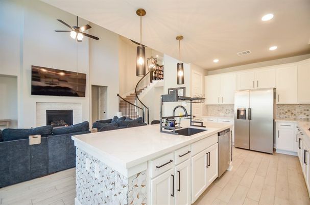 Fireplace, Interior, Kitchen, Living room, Pendant Lights, Recessed Lighting, Stainless Steel Appliances, Wood Texture Flooring