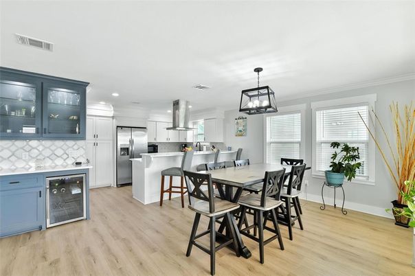Dining room, Interior, Kitchen, Pendant Lights, Recessed Lighting, Stainless Steel Appliances, Wood Texture Flooring