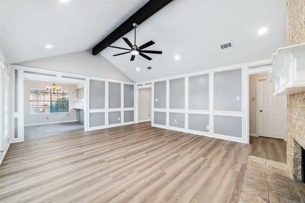 Chandelier, Empty room, Fireplace, Interior, Recessed Lighting, Wooden Beams, Wood Texture Flooring