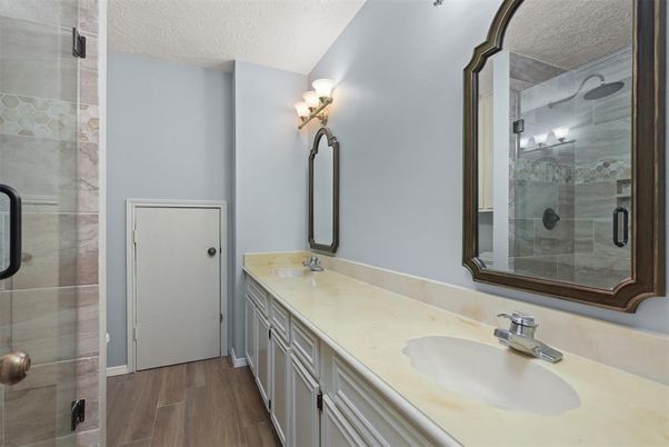 Bathroom, Dual Sink Vanities, Glass Shower, Interior, Wood Texture Flooring