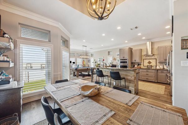 Chandelier, Dining room, Interior, Kitchen, Pendant Lights, Recessed Lighting, Stainless Steel Appliances, Wood Texture Flooring