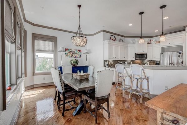 Chandelier, Dining room, Interior, Kitchen, Pendant Lights, Recessed Lighting, Stainless Steel Appliances, Wood Texture Flooring